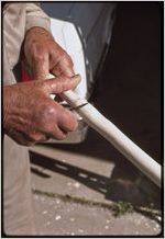 Woodwork: Clyde Paul. Clyde Paul carving walking stick.