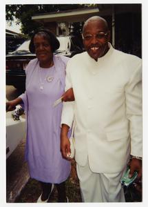 Color photograph of an unidentified African American man and woman, dressed formally, possibly for a wedding