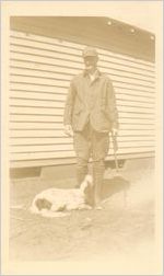 Photograph with Johnny Mize in hunting gear holding rifle with dog