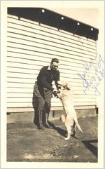 Photograph of Johnny Mize in hunting outfit with dog