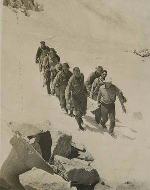 Rescuers carrying the body of a plane crash victim