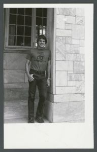 Residence halls - Student posing by Dobbs hall