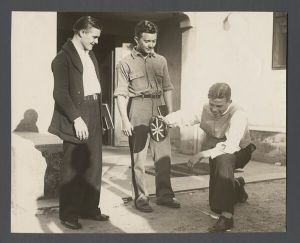 Freshman camp - Student kneeling in front of two standing students