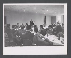 Business School - Man speaking at dinner