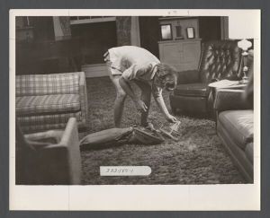 Students, groups, 1970s - Student working with vacuum cleaner in dorm room