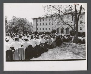 Law School - Students at tables in front of administration building
