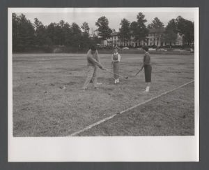 School of Nursing - Physical education instructor James McLellan teaching student Anne Vincent and nursing student Mary Todd Wolfe golf