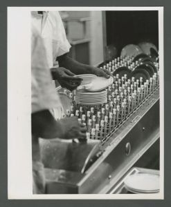 Cox Hall - Kitchen staff loading dirty dishes into dishwasher