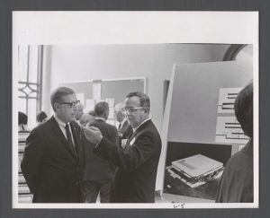 Law School - Men standing by architectural rendering of Gambrell Hall