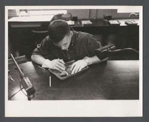 Students, groups, 1940s-1950s - Student dissecting a frog
