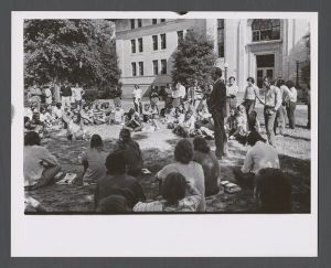Students, groups, 1970s - Man speaking to student crowd on quad