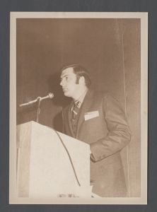 Students, groups, 1970s - Unidentified man speaking from podium