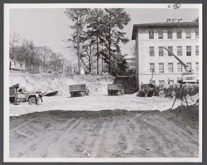 Campus construction, 1940s-1960s - Trucks entering cleared area