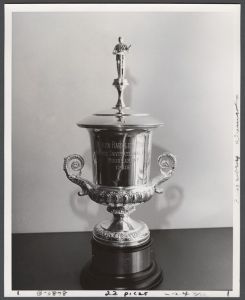 Candid campus photographs with unidentified individuals - Debate Tournament trophy