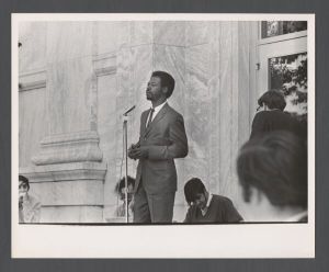 Students, groups, 1970s - Man speaking to a crowd