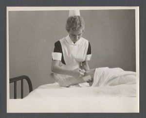 School of Nursing - Student nurse Jane Blake practicing bandaging with a mannequin patient