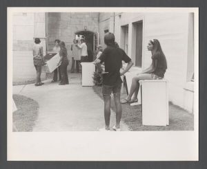Students, groups, 1970s - Students hauling appliances near dorms