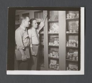 School of Dentistry, 1950s - Two dental students looking at dental molds