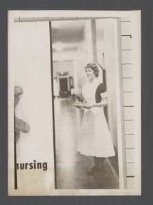 School of Nursing - Nurse holding tray in a hospital hallway