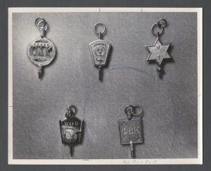 Inter-fraternity and sorority activities - A variety of fraternity insignia pins including Omicron Delta Kappa, Eta Sigma Psi, and Phi Beta Kappa