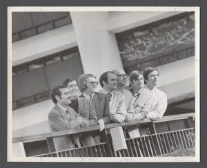 Students, groups, 1970s - Seven men posing by library railing