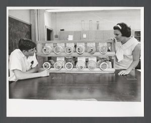Students, individuals - Two students working with lab experiment