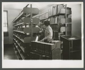 Library - Staff shelving books
