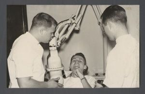 School of Dentistry, 1950s - Students examine fellow student's teeth