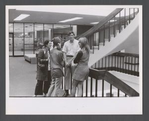 Library Special Collections - Students talking by staircase