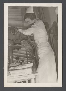 School of Nursing - Nurse using X-Ray equipment on a patient's jaw