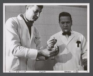 Psychology Department - Dr. Conner loading a tranquilizer gun