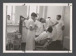 School of Dentistry, 1950s - Students observe dental procedure