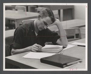 Students studying, 1960s - Student studying in library