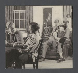Presentation of awards - Unidentified boys lounge in room with trophies