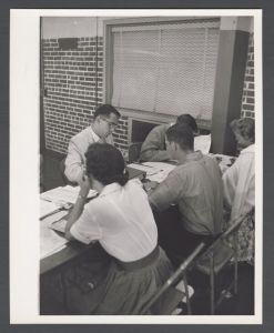 Registration - Going through papers at table