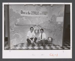 School of Theology - Students in front of a world map show location of international student's countries of origin