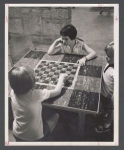 Faculty Camp - Two girls play checkers
