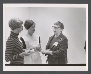 School of Medicine - Three women talking at an event