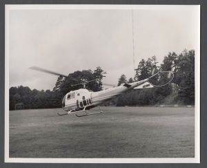 Aerial campus photographs - Helicopter landing on athletic field