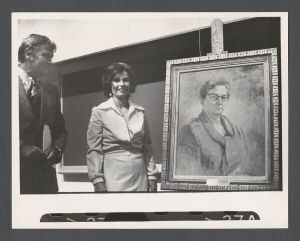 School of Nursing - Dr. Garland Herndon, vice president for health affairs and Betty Marie Stewart, president of nursing school alumni, in front of a portrait of Dean of Nursing Ada Fort