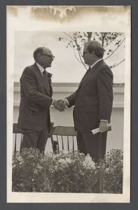 Commencement, 1970s and 1980s - Two men shake hands