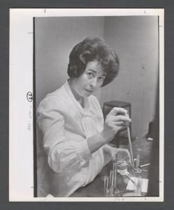 Students, groups, 1970s - Staff member working in lab