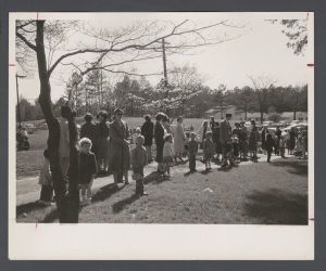 Easter egg hunt, May 1956 - Children wait with their parents
