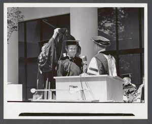 Commencement, 1970s - Unidentified figure being hooded