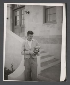 Presentation of awards - Unidentified man with golf trophy