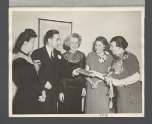 Law School - Mrs. Dewey presenting the book "Until Now" to Robert Whitaker