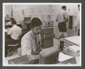 School of Dentistry - Man at desk by lockers