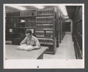 School of Medicine - Student reading on the first floor in the Documents Center