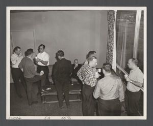Business School - Group of people talking by window