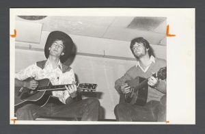 Identified Speakers and Entertainers - Rathskellar cast members playing guitar